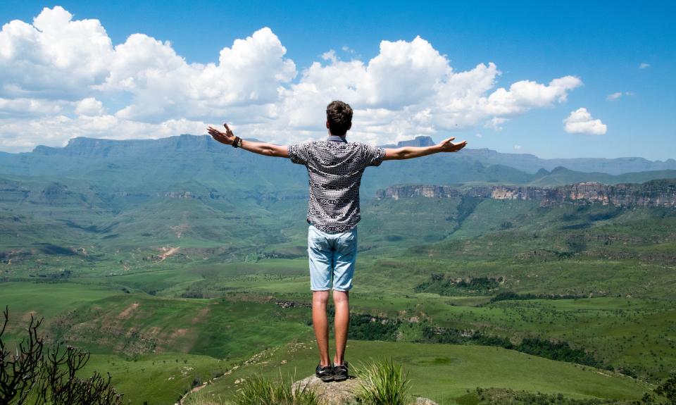 Person standing on a mountain summit